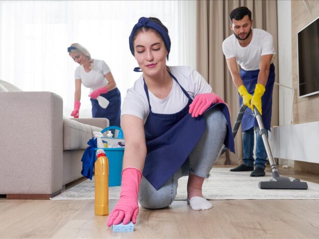 professional-cleaning-service-team-cleans-living-room-modern-apartment professional-cleaning-service-team-cleans-living-room-modern-apartment